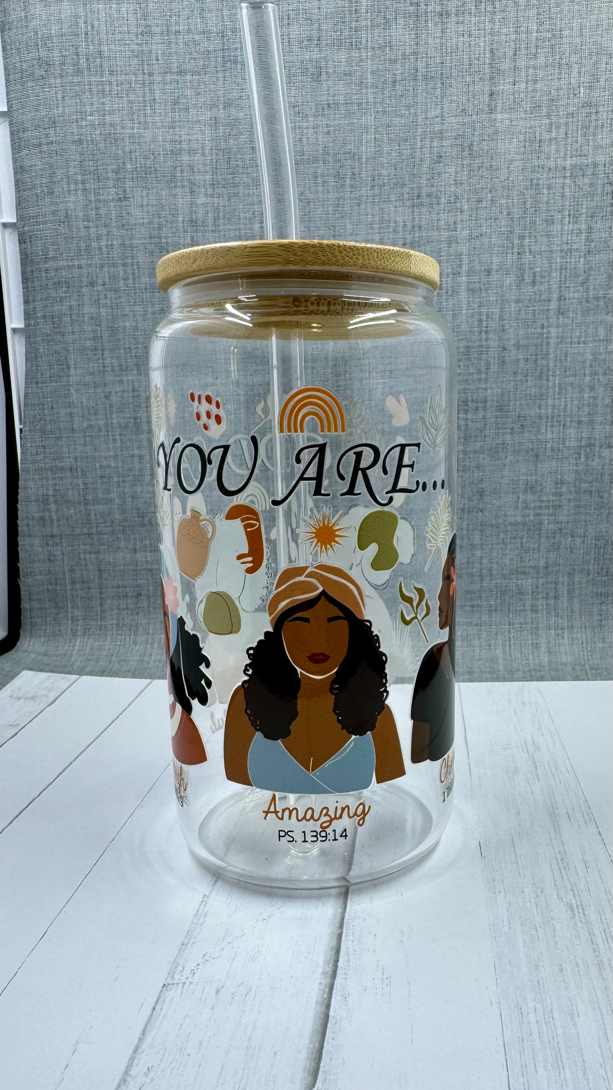 Experience the power of positive affirmations with our God Says You Are... Glass Tumbler. This 16 ounce tumbler features uplifting words of beauty, strength, and more, reminding you of your true potential. Made with UV DTF transfer for long-lasting use. Refresh your soul with every sip.