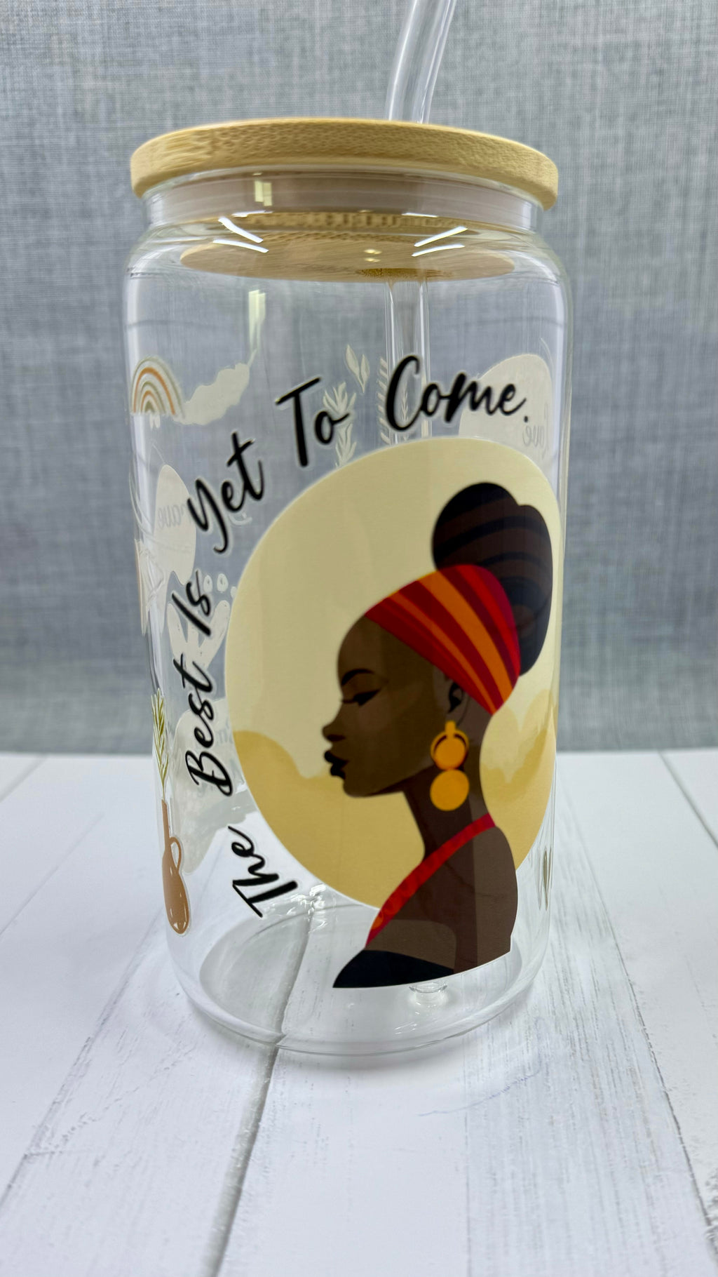 Introducing The Best Is Yet To Come Glass Tumbler. Crafted with a UV DTF transfer, this 16 oz tumbler features a motivational quote to inspire you daily. Enjoy your favorite beverage while reminding yourself that the best is yet to come. Stay positive and motivated with this stylish glass tumbler.