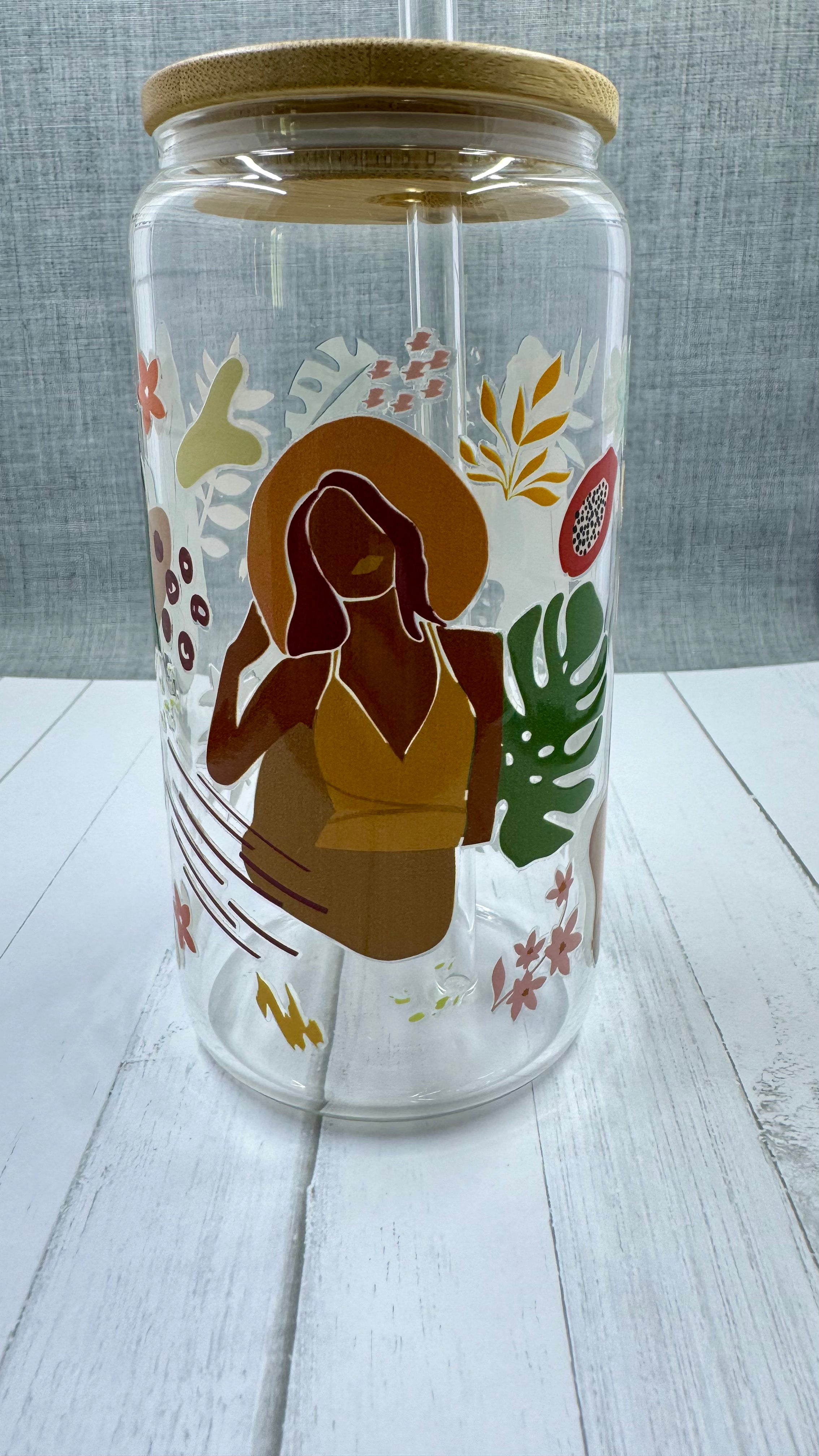 This Black Girl Glass Tumbler along with a glass straw holds 16 ounces and is wrapped in durable UV DTF material, ensuring long-lasting use for all your beverages. Showcasing a black girl design, this tumbler is both stylish and functional, making it the perfect choice for any drink on-the-go.