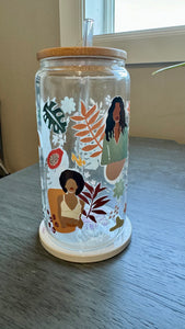 This Black Girl Glass Tumbler along with a glass straw holds 16 ounces and is wrapped in durable UV DTF material, ensuring long-lasting use for all your beverages. Showcasing a black girl design, this tumbler is both stylish and functional, making it the perfect choice for any drink on-the-go.