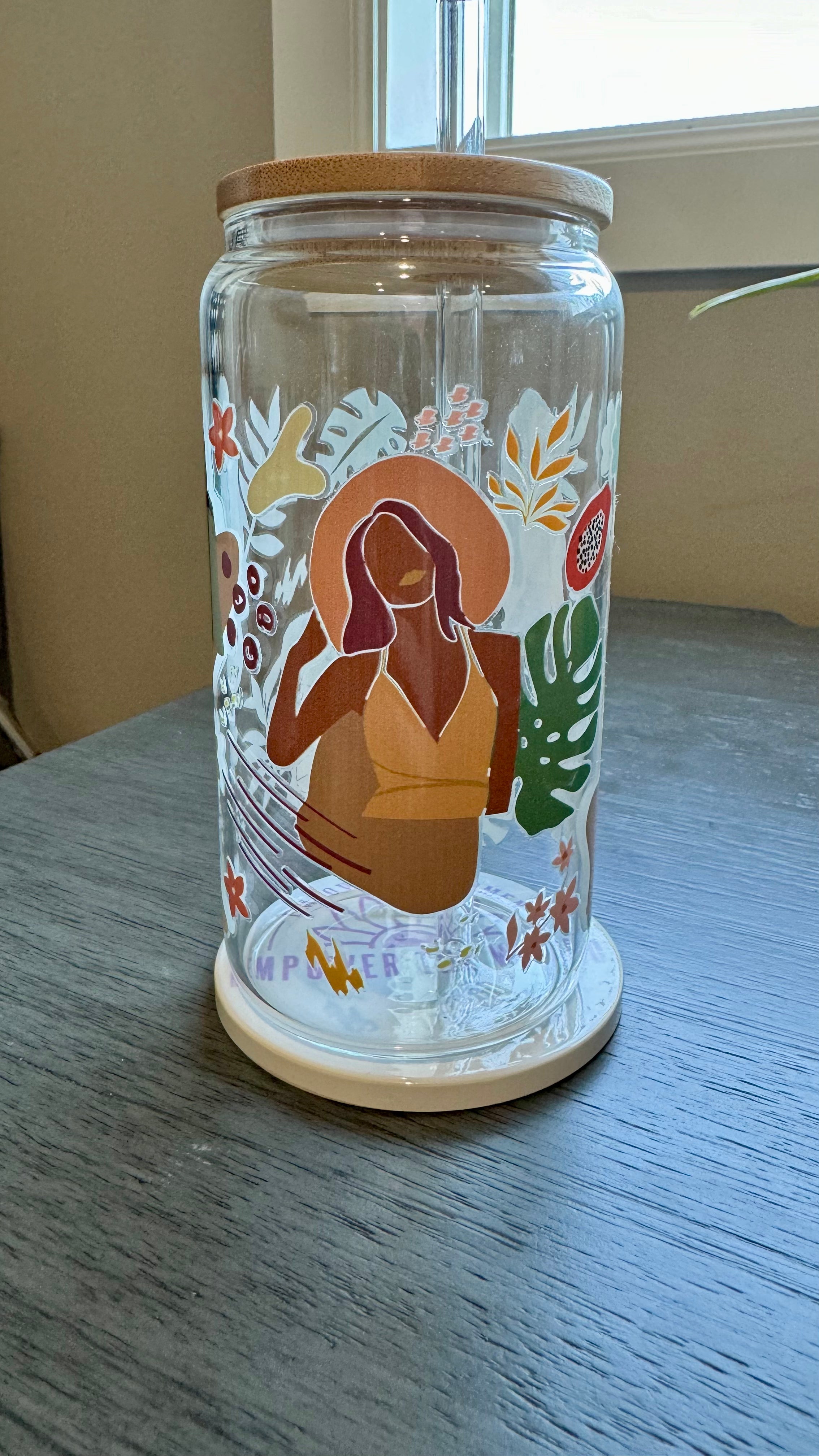 This Black Girl Glass Tumbler along with a glass straw holds 16 ounces and is wrapped in durable UV DTF material, ensuring long-lasting use for all your beverages. Showcasing a black girl design, this tumbler is both stylish and functional, making it the perfect choice for any drink on-the-go.