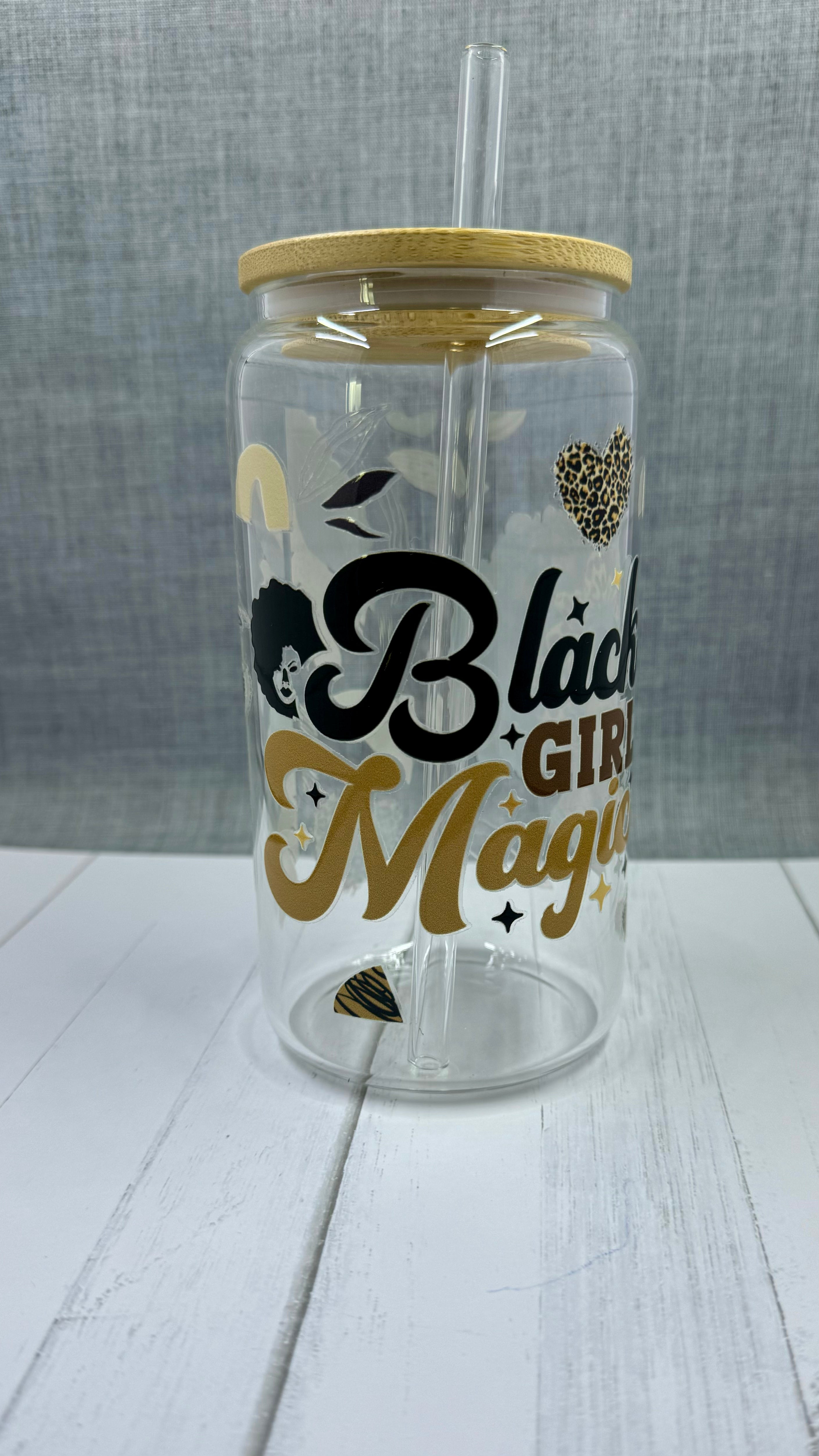 Introducing the Black Girl Magic Glass Tumbler. This 16 ounce tumbler features a beautiful "Black Girl Magic" design, created through UV DTF transfer technology. Show off your pride and hydration with this high-quality glass tumbler.