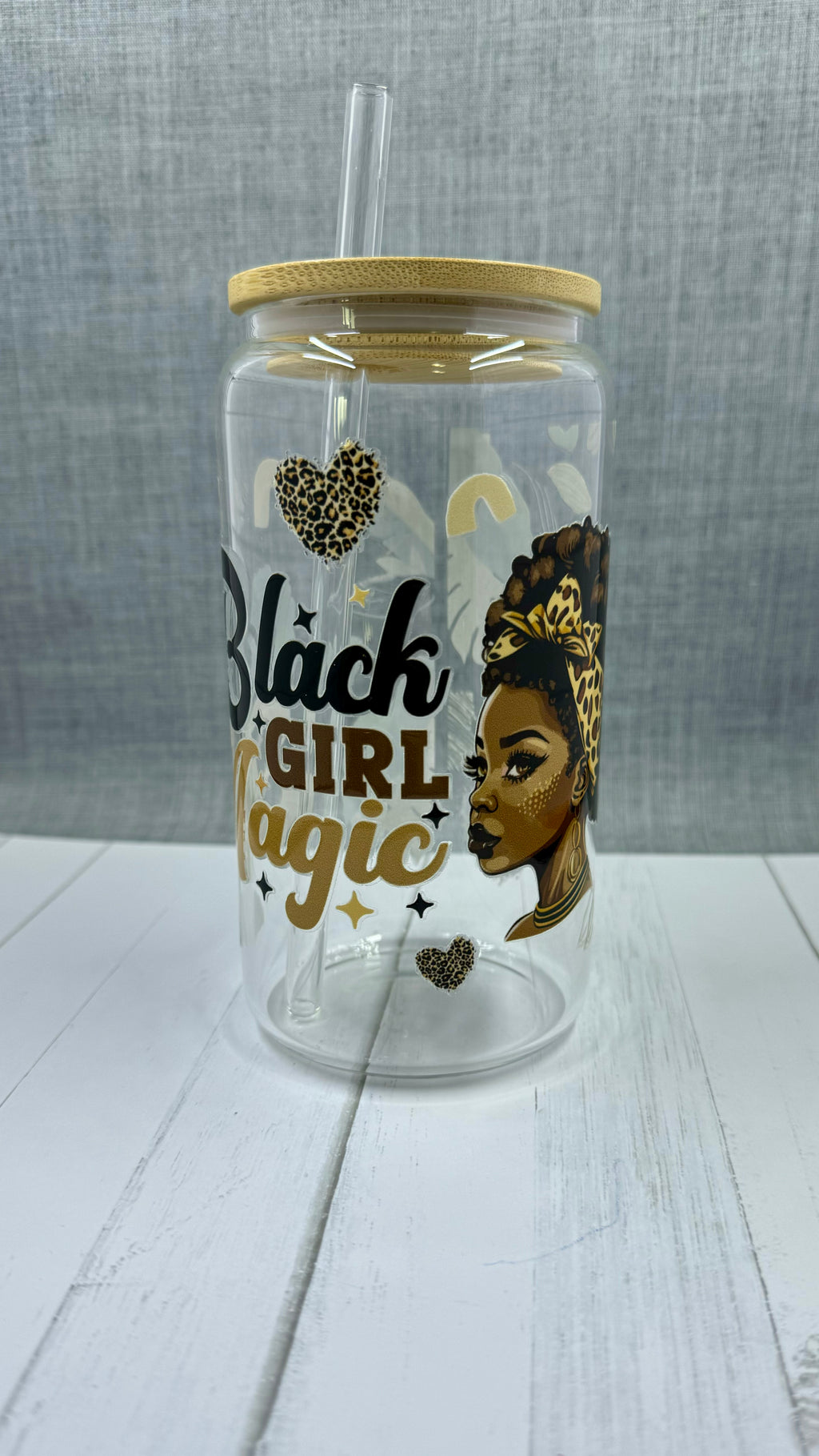 Introducing the Black Girl Magic Glass Tumbler. This 16 ounce tumbler features a beautiful "Black Girl Magic" design, created through UV DTF transfer technology. Show off your pride and hydration with this high-quality glass tumbler.