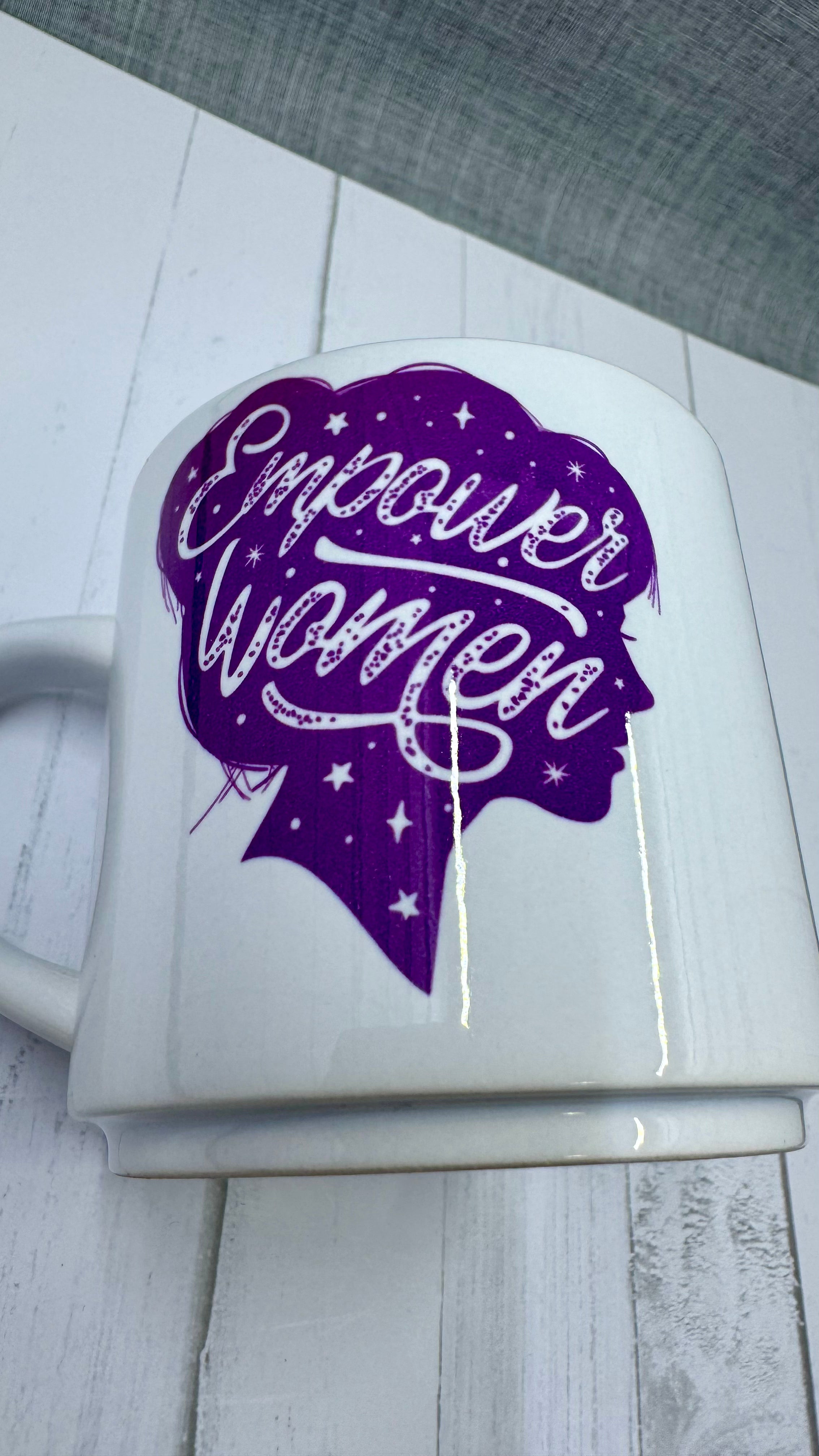 Experience the power of women with our Empower Women Mug. Made with long-lasting ceramic and infused with empowering words in long-lasting infusible ink, this mug is a daily reminder of the strength and resilience of women. Join the movement and start your day with a cup of empowerment.The infusible ink used in the design process ensures long-lasting and vibrant colors, making this mug a perfect addition to any collection. Create a unique and stylish statement with this expertly crafted mug.