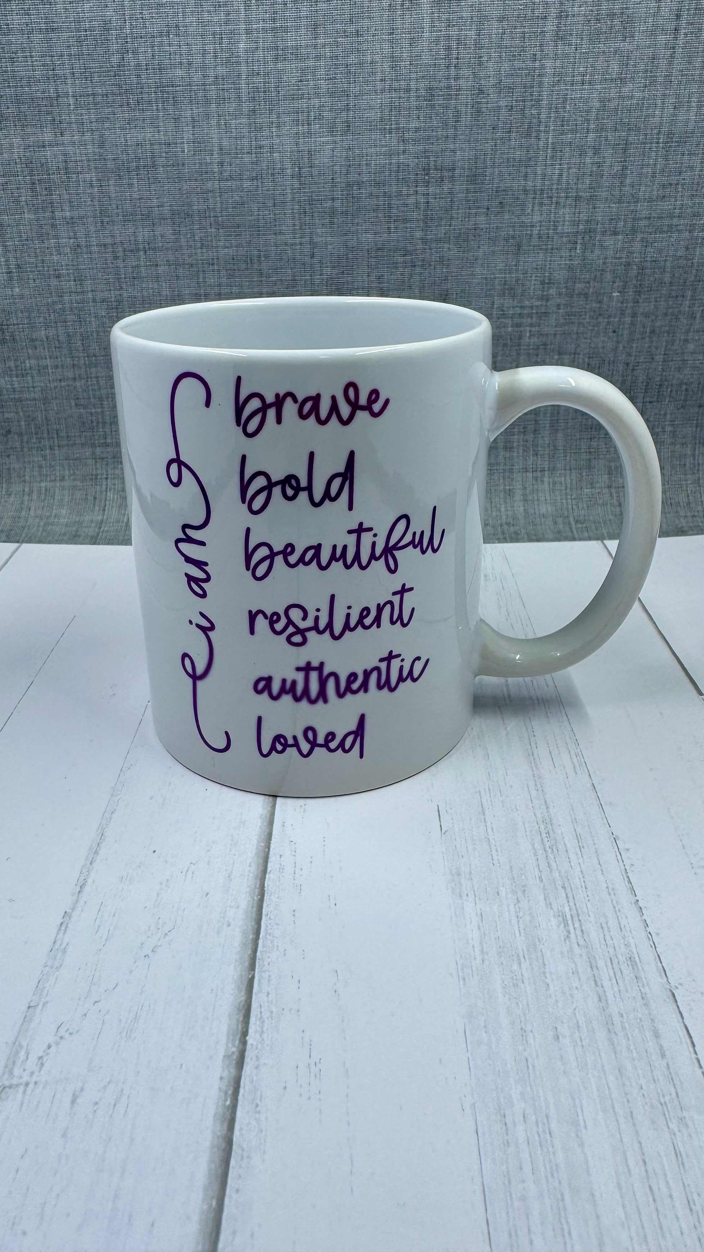 Our Affirmation Mug is a beautiful and durable ceramic mug that features an affirmation reminder that you are brave, bold, beautiful, resilient, authentic, and loved. The infusible ink used in the design process ensures long-lasting and vibrant colors, making this mug a perfect addition to any collection. Create a unique and stylish statement with this expertly crafted mug.