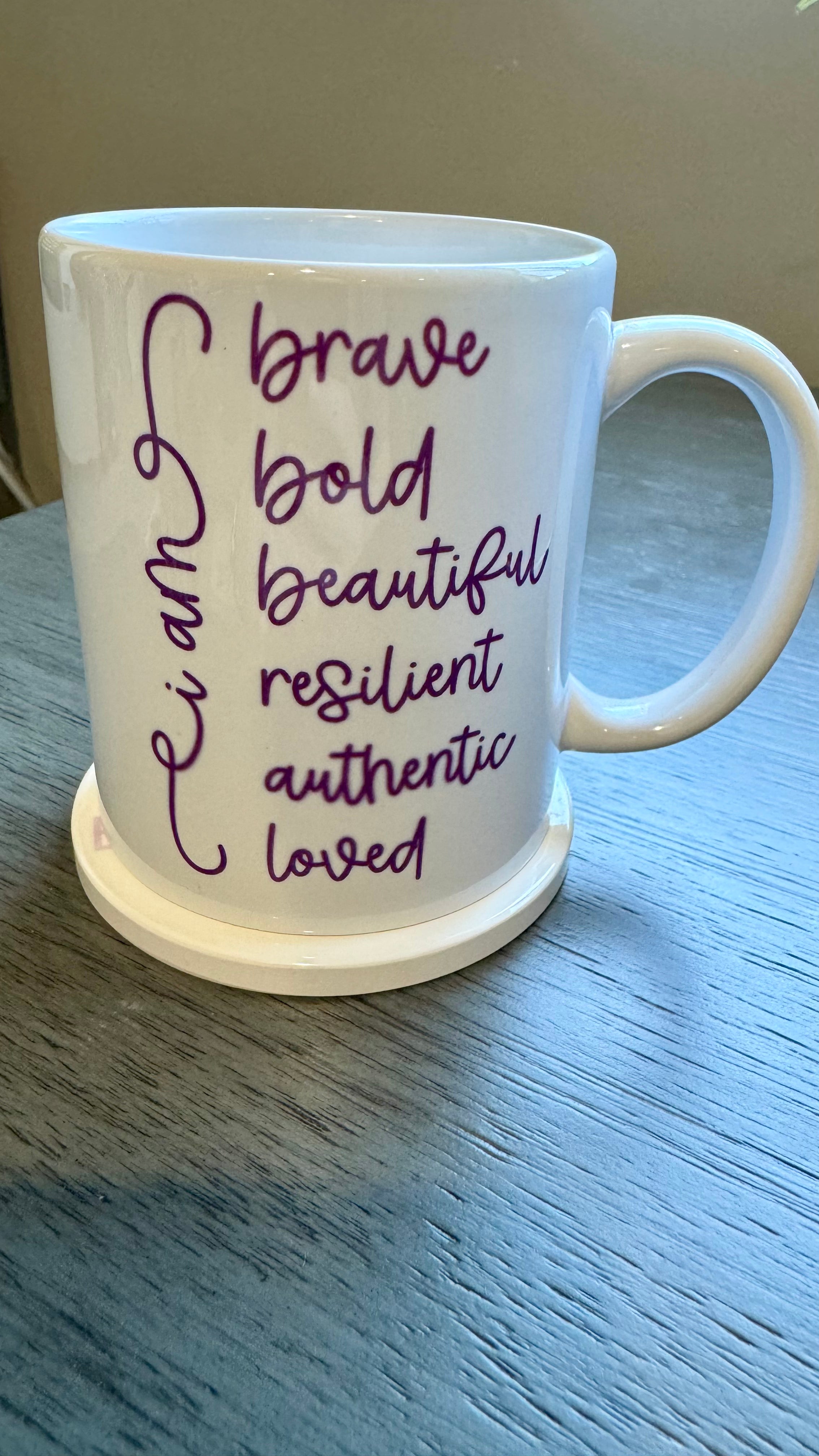 Our Affirmation Mug is a beautiful and durable ceramic mug that features an affirmation reminder that you are brave, bold, beautiful, resilient, authentic, and loved. The infusible ink used in the design process ensures long-lasting and vibrant colors, making this mug a perfect addition to any collection. Create a unique and stylish statement with this expertly crafted mug.