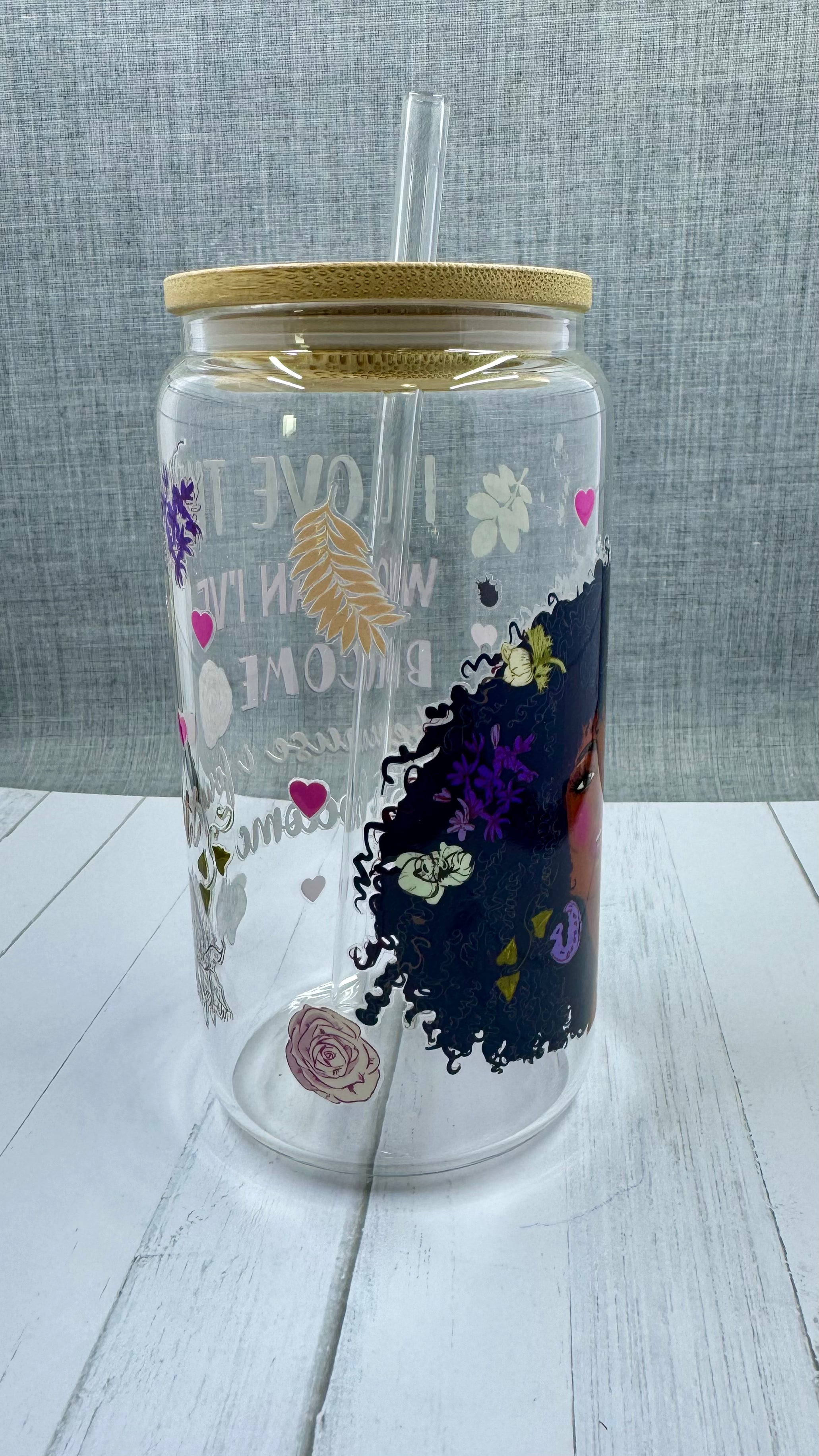 Elevate your drinkware with our 16 ounce glass tumbler featuring UV DTF transfer of our empowering phrase, "I love the woman I've become because I fought to become her". As a black queen, show your strength with every sip.