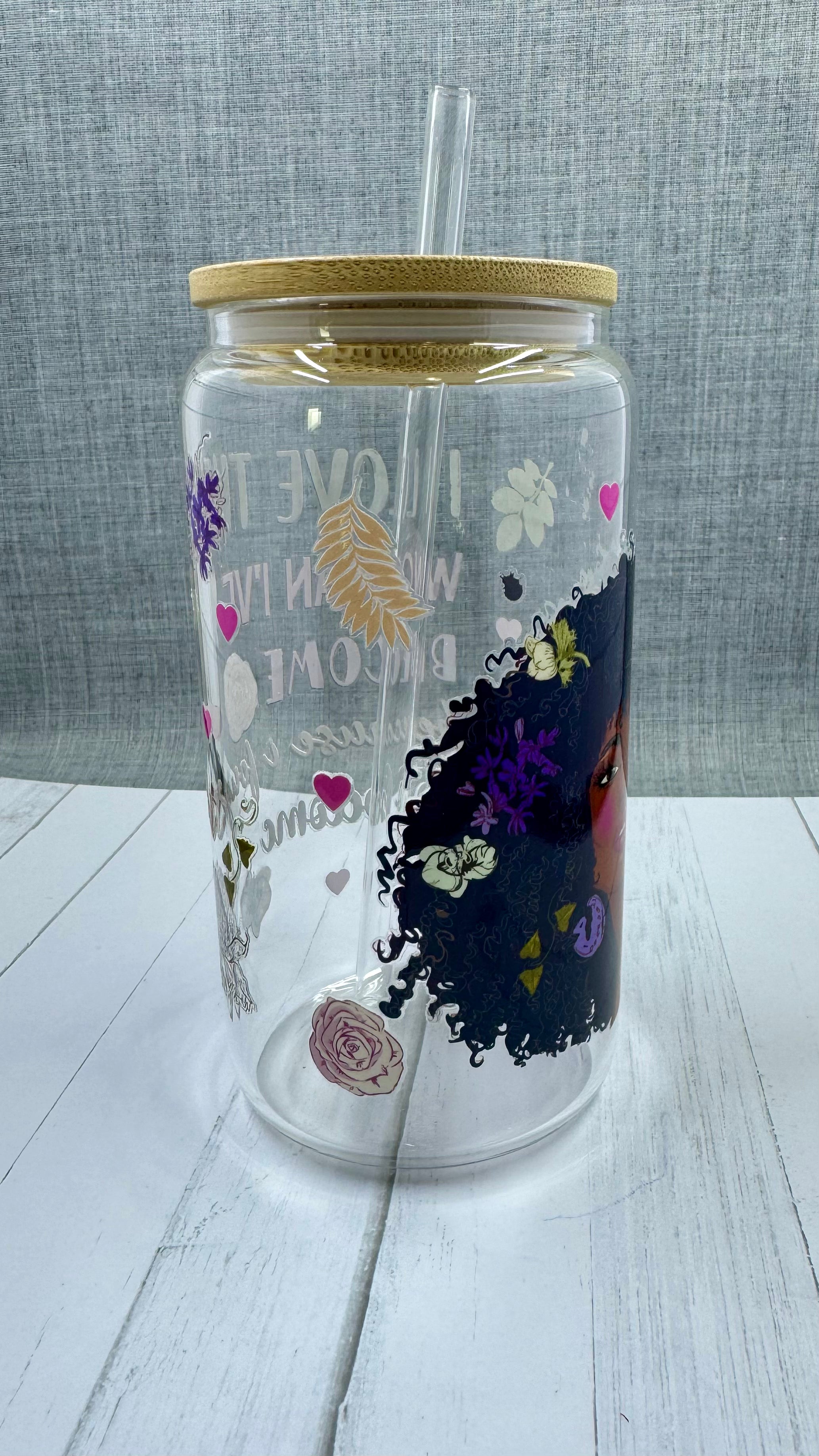 Elevate your drinkware with our 16 ounce glass tumbler featuring UV DTF transfer of our empowering phrase, "I love the woman I've become because I fought to become her". As a black queen, show your strength with every sip.