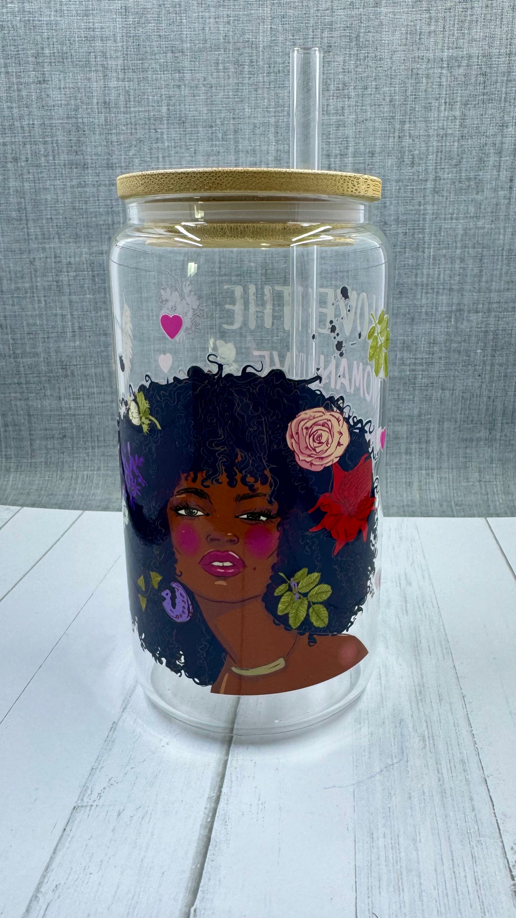 Elevate your drinkware with our 16 ounce glass tumbler featuring UV DTF transfer of our empowering phrase, "I love the woman I've become because I fought to become her". As a black queen, show your strength with every sip.