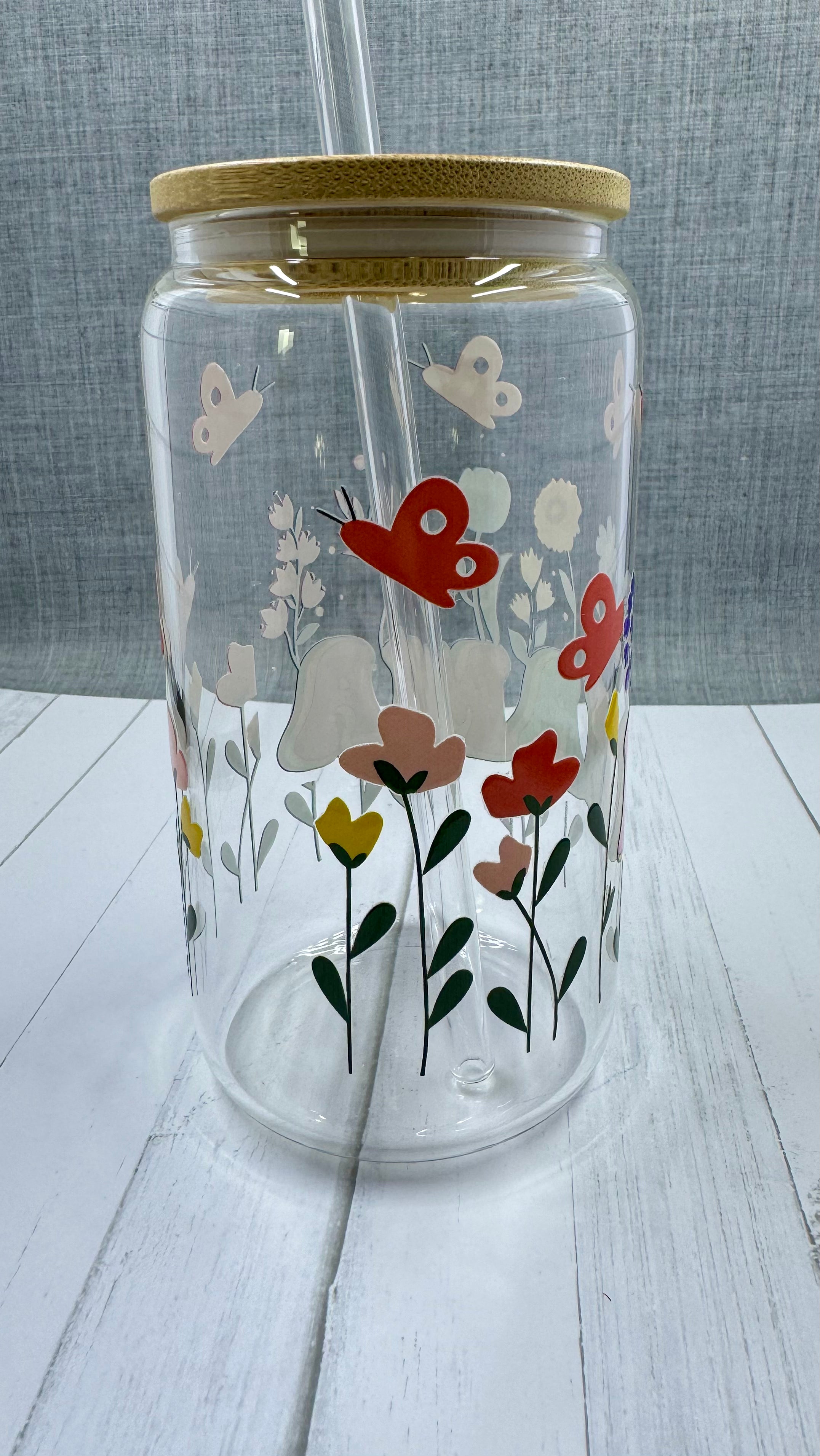 The MAMA Glass Tumbler features a beautiful UV DTF transfer design of flowers and butterflies. With a 16 ounce capacity, it is perfect for your favorite cold beverages. Stay hydrated and in style with this elegant and durable tumbler.