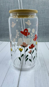 The MAMA Glass Tumbler features a beautiful UV DTF transfer design of flowers and butterflies. With a 16 ounce capacity, it is perfect for your favorite cold beverages. Stay hydrated and in style with this elegant and durable tumbler.