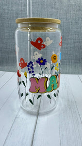 The MAMA Glass Tumbler features a beautiful UV DTF transfer design of flowers and butterflies. With a 16 ounce capacity, it is perfect for your favorite cold beverages. Stay hydrated and in style with this elegant and durable tumbler.