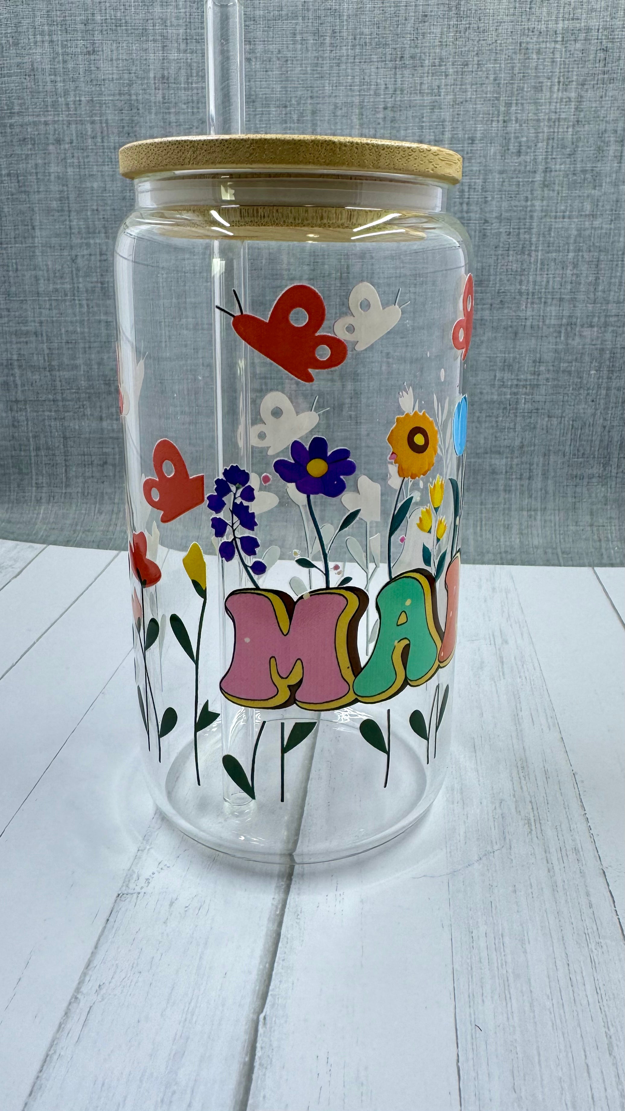 Celebrate Mother's Day with our MAMA Glass Tumbler Set. This 16oz tumbler features a unique UV DTF transfer, perfect for moms who appreciate quality and style. The set also includes a beautifully designed Mother's Day card with a wax seal for an extra personal touch. Show your love and appreciation with this thoughtful gift set.