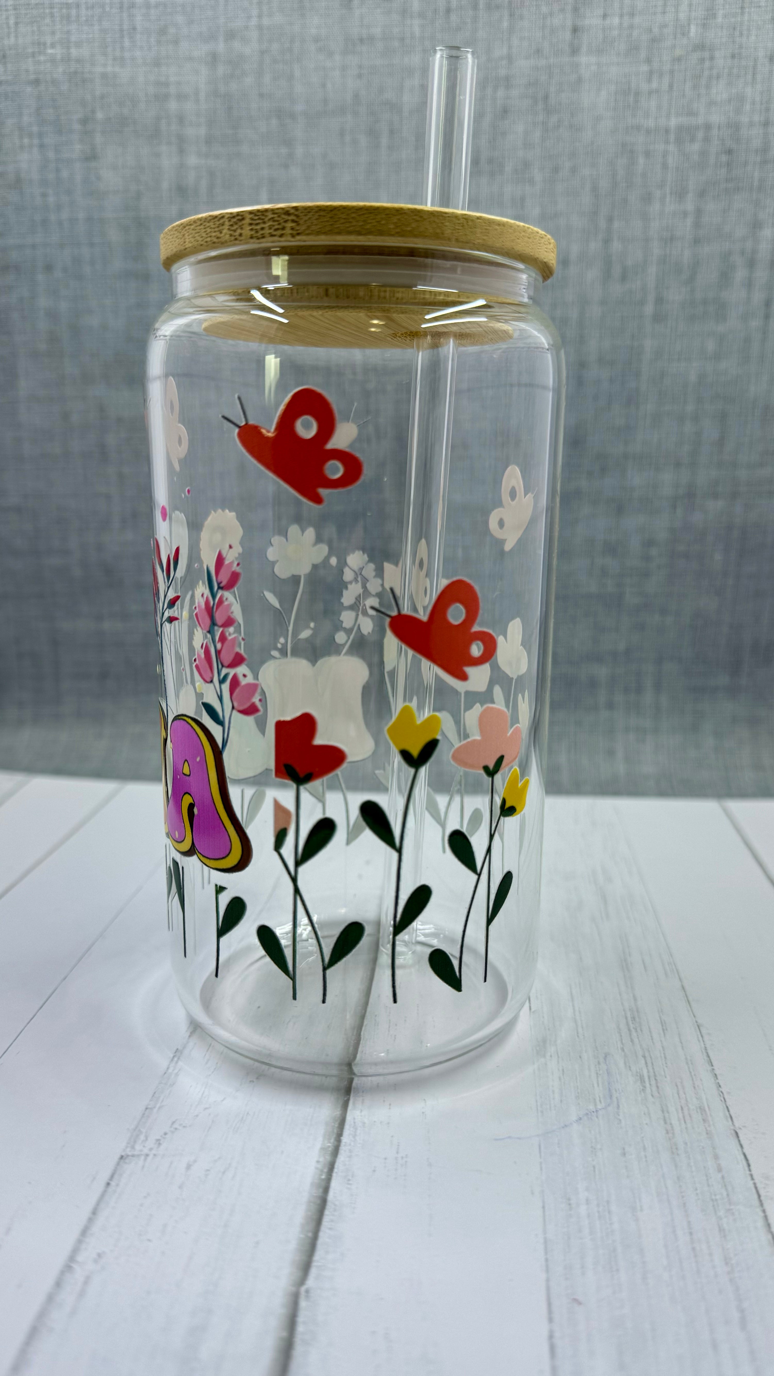 The MAMA Glass Tumbler features a beautiful UV DTF transfer design of flowers and butterflies. With a 16 ounce capacity, it is perfect for your favorite cold beverages. Stay hydrated and in style with this elegant and durable tumbler.