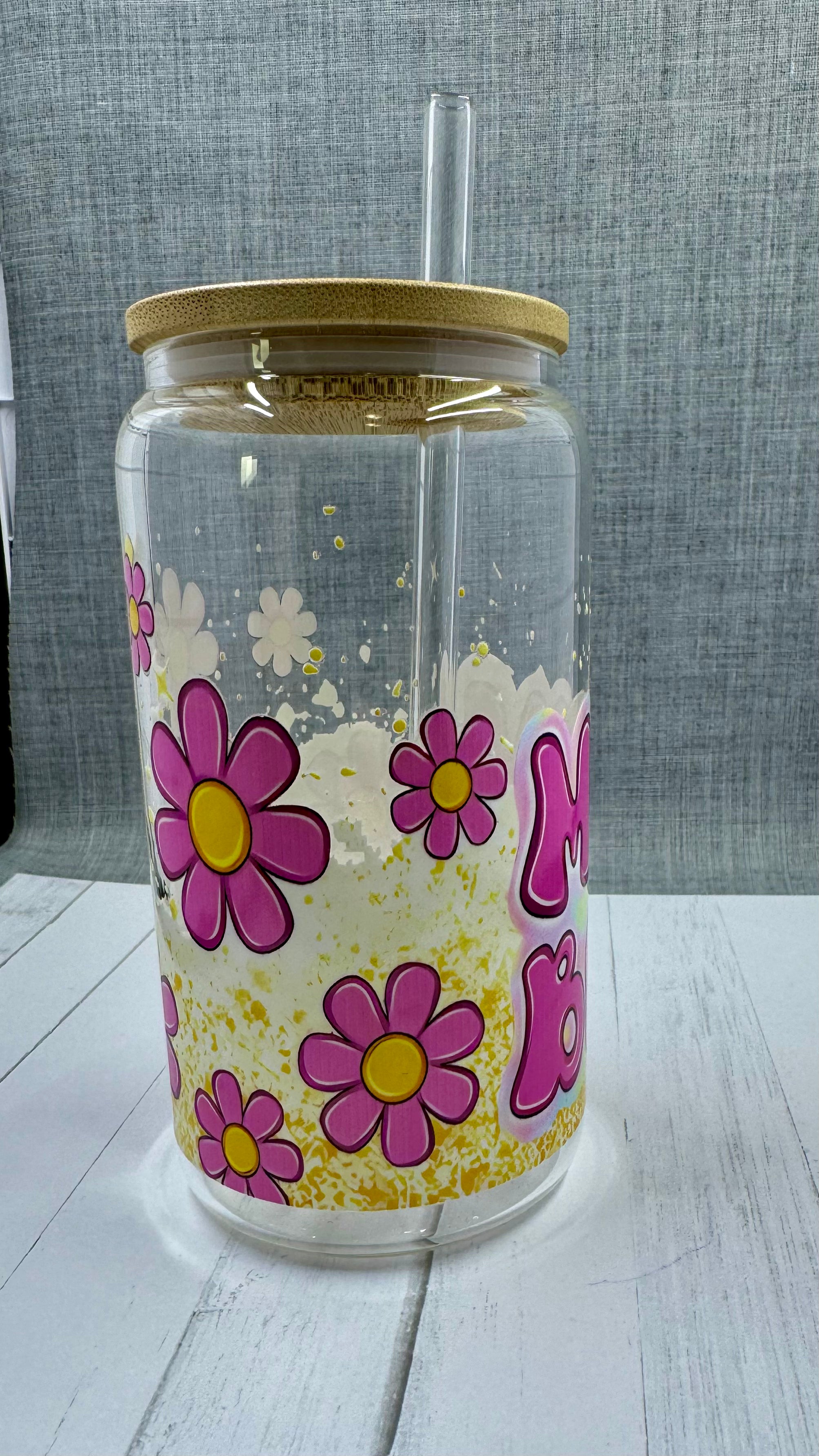 This 16 ounce Mom Boss Glass Tumbler is the perfect accessory for every working mom. The UV DTF transfer ensures long-lasting quality, while the vibrant pink and yellow floral design adds a touch of femininity. Stay hydrated and motivated with this empowering tumbler.