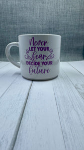 This mug is a beautiful and durable ceramic mug that features an important reminder to never let your fear decide your future. The infusible ink used in the design process ensures long-lasting and vibrant colors, making this mug a perfect addition to any collection. Create a unique and stylish statement with this expertly crafted mug.