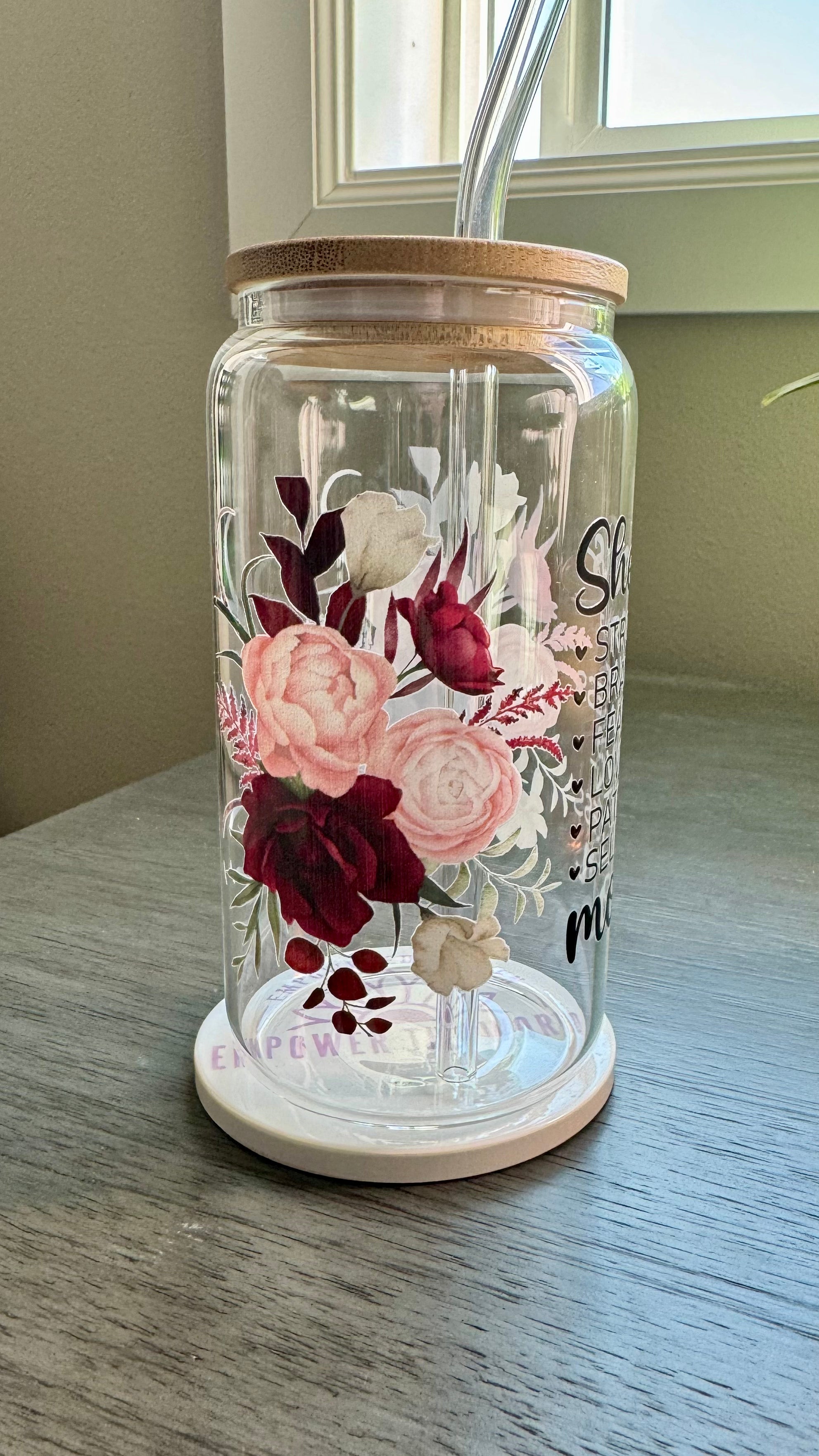 Elevate your gift-giving game with our She is...mom Glass Tumbler. Crafted with a 16 ounce capacity, this tumbler is adorned with beautiful red and pink roses. The UV DTF transfer showcases the phrase "she is strong brave fearless loving patient selfless mom", making it the perfect way to show appreciation for the special mom in your life.