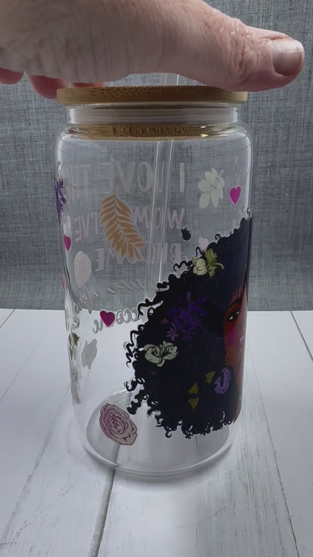 Elevate your drinkware with our 16 ounce glass tumbler featuring UV DTF transfer of our empowering phrase, "I love the woman I've become because I fought to become her". As a black queen, show your strength with every sip.