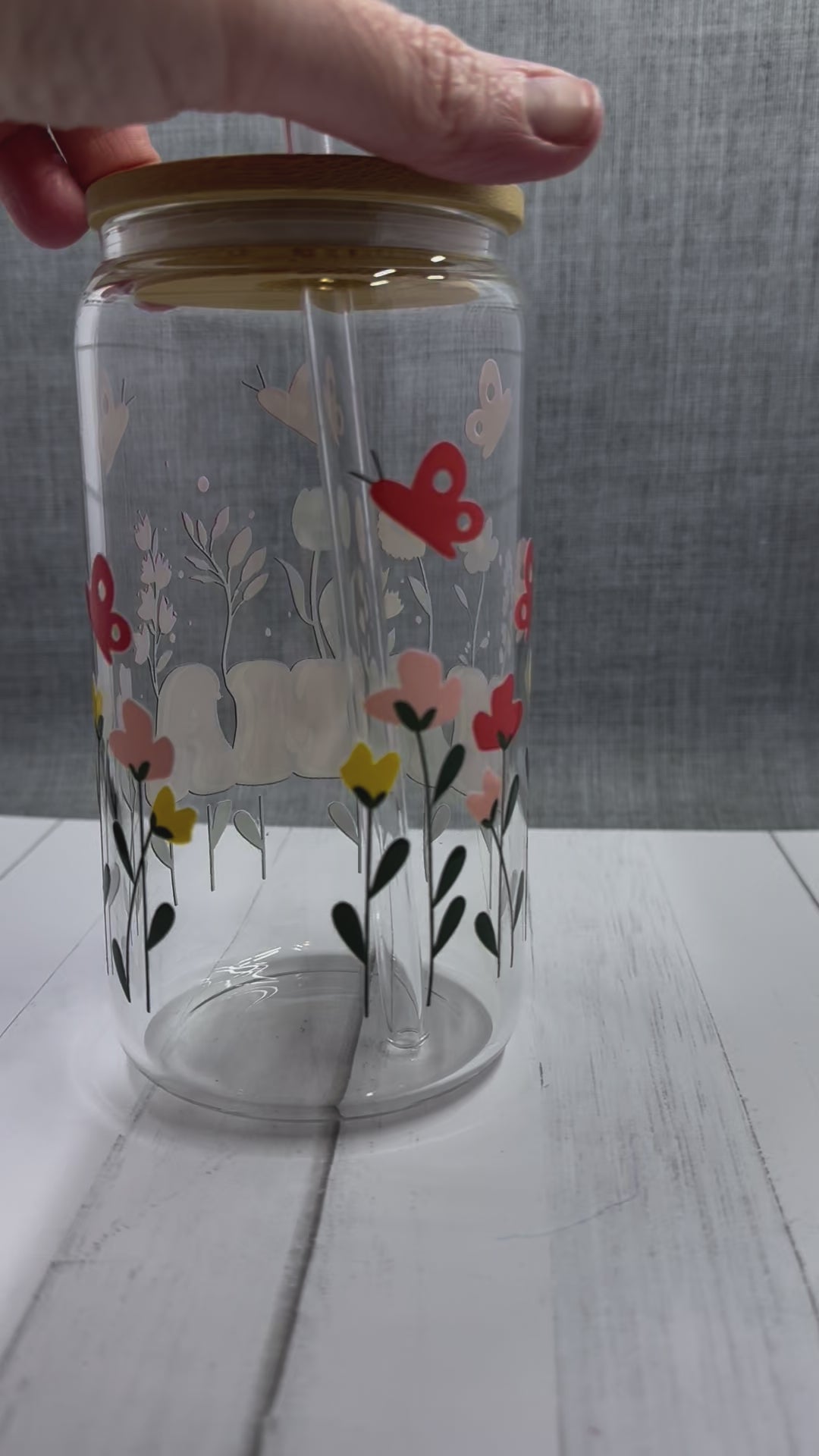 The MAMA Glass Tumbler features a beautiful UV DTF transfer design of flowers and butterflies. With a 16 ounce capacity, it is perfect for your favorite cold beverages. Stay hydrated and in style with this elegant and durable tumbler.